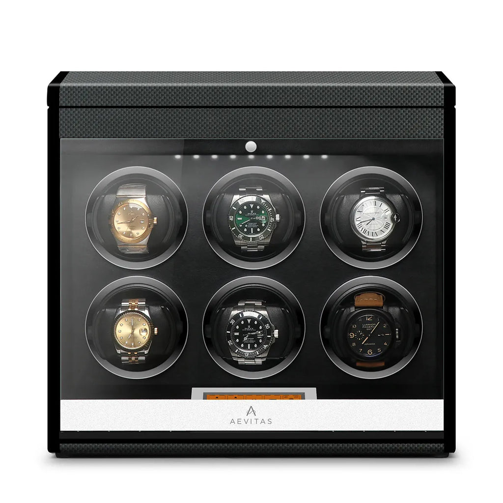 Aevitas carbon fibre 6-watch winder with a glass door, black interior, and digital control display for automatic watches.