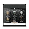 Aevitas carbon fibre 6-watch winder with a glass door, black interior, and digital control display for automatic watches.