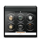 Aevitas carbon fibre 6-watch winder with a glass door, black interior, and digital control display for automatic watches.