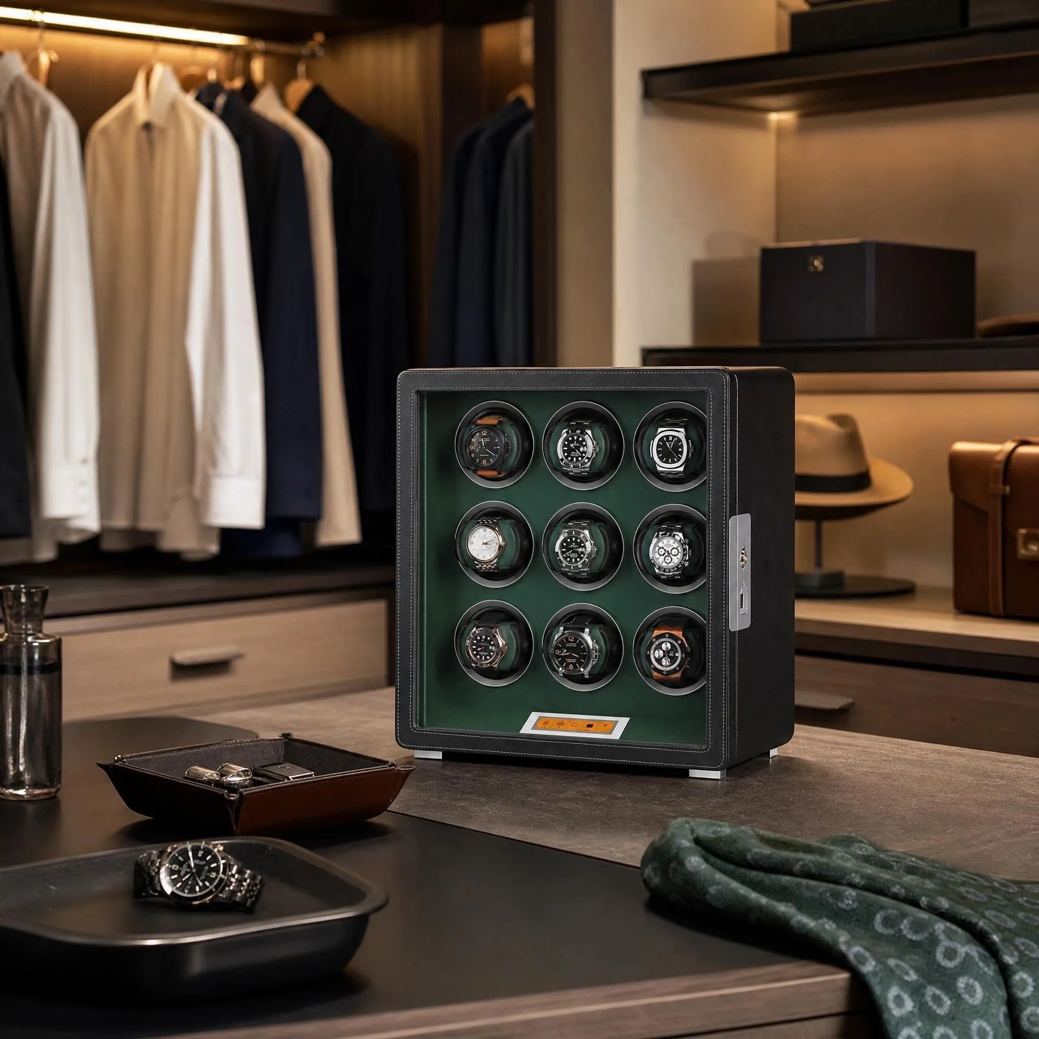 High-end 9 Watch Winder in black leatherette with green interior in a modern dressing room scene, showcasing sleek design and textured wooden shelves.