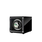 Aevitas single watch winder in high-gloss piano black with a clear front display holding a silver automatic watch.