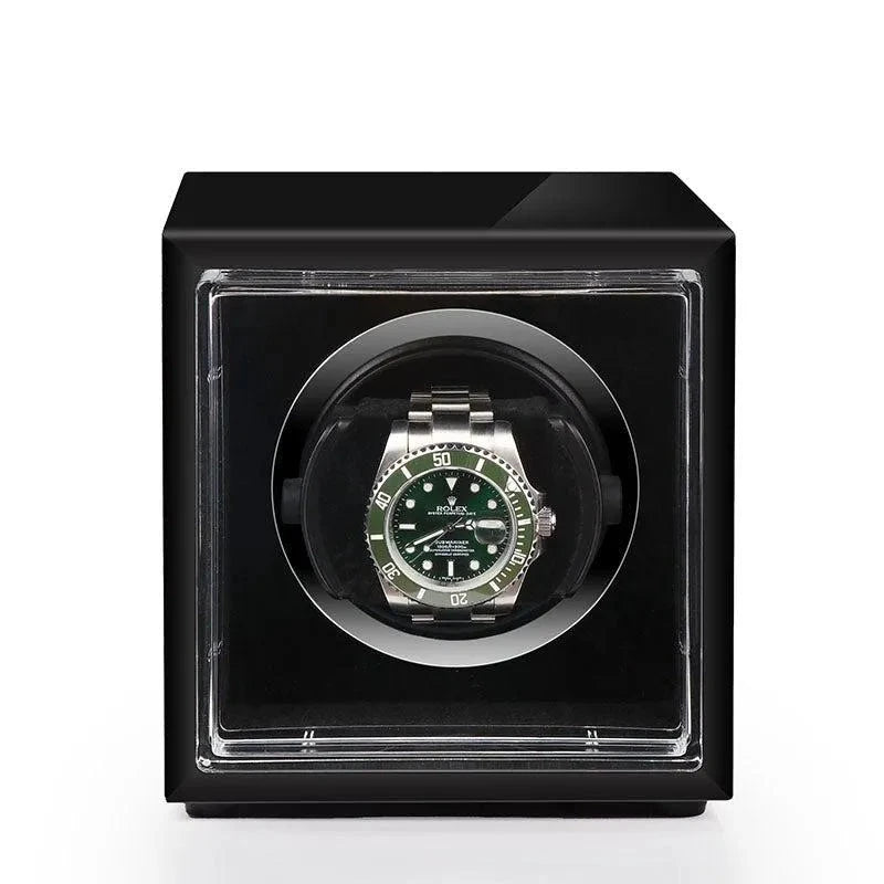 Aevitas single watch winder in high gloss piano black with a green Rolex Submariner displayed inside.