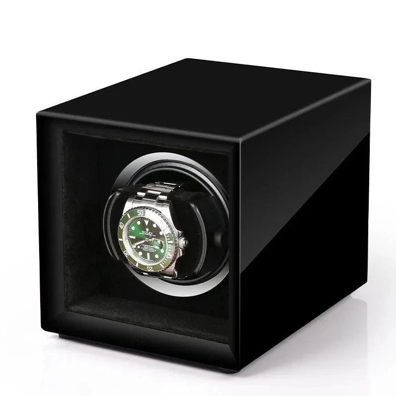 Aevitas single watch winder in high-gloss piano black with a silver interior holding a green-faced automatic watch.