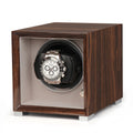 Single watch winder in glossy Ebony Macassar wood with a soft grey interior, featuring a silver automatic watch inside.