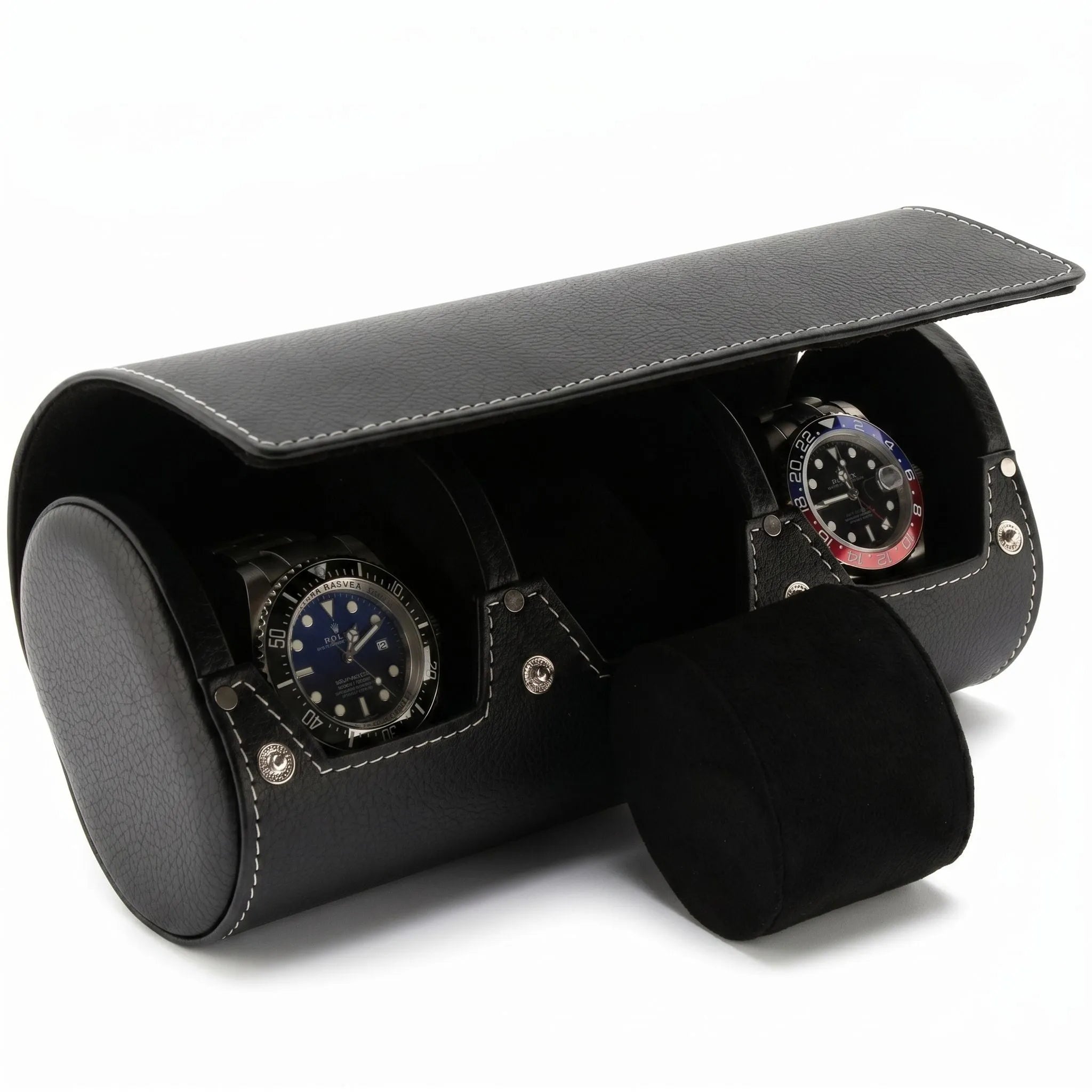Close-up of black genuine leather triple watch roll with soft lining, showcasing texture and craftsmanship against a neutral background.