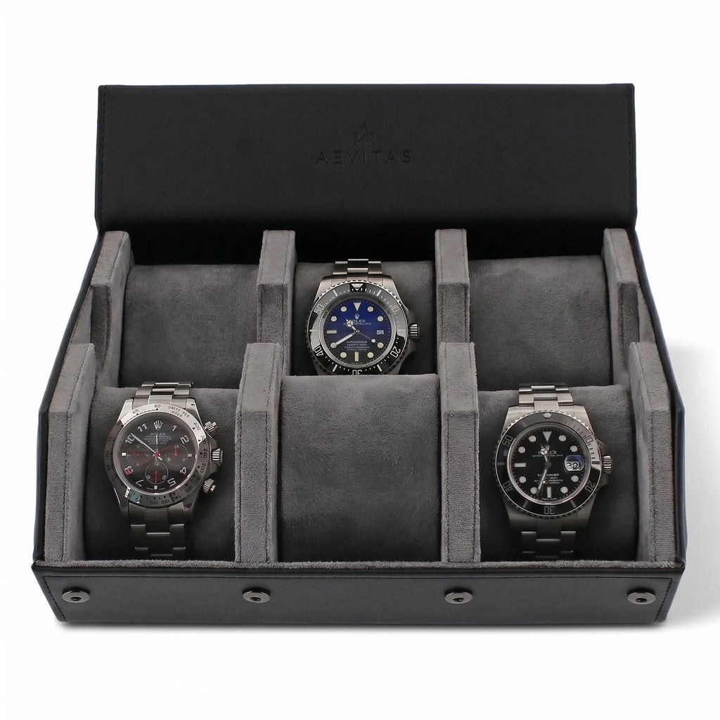 High-resolution image of a black leather watch travel case with grey lining, hexagon design, against a white background with gentle right side light.