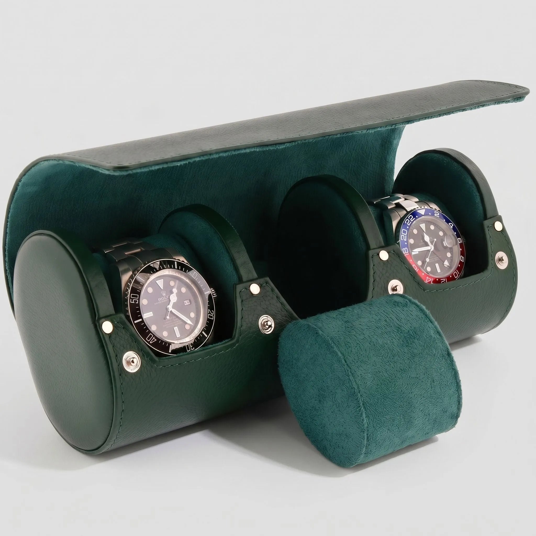 Green genuine leather triple watch travel case by Aevitas, soft-lined for protection, on a white background with natural light and gentle shadow.