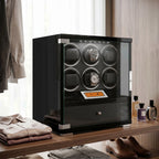 Elegant 6-watch winder in piano black wood finish with storage drawer, set in upscale walk-in dressing room with plush props and designer accessories.