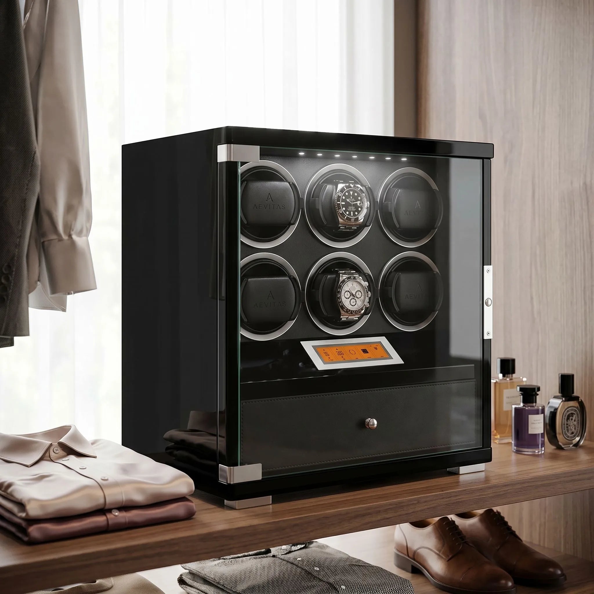 Elegant 6-watch winder in piano black wood finish with storage drawer, set in upscale walk-in dressing room with plush props and designer accessories.