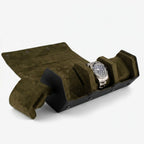 High-quality image of a black Nappa leather hexagon watch roll case with green lining, illuminated to showcase craftsmanship and design.