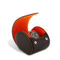 Close-up of premium black Nappa leather watch roll case with orange Alcantara lining, highlighting craftsmanship and texture.