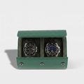 Close-up of a premium green leather watch roll with soft suede lining, gentle right-side shadow, and seamless background highlighting craftsmanship.