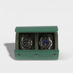 Close-up of a premium green leather watch roll with soft suede lining, gentle right-side shadow, and seamless background highlighting craftsmanship.