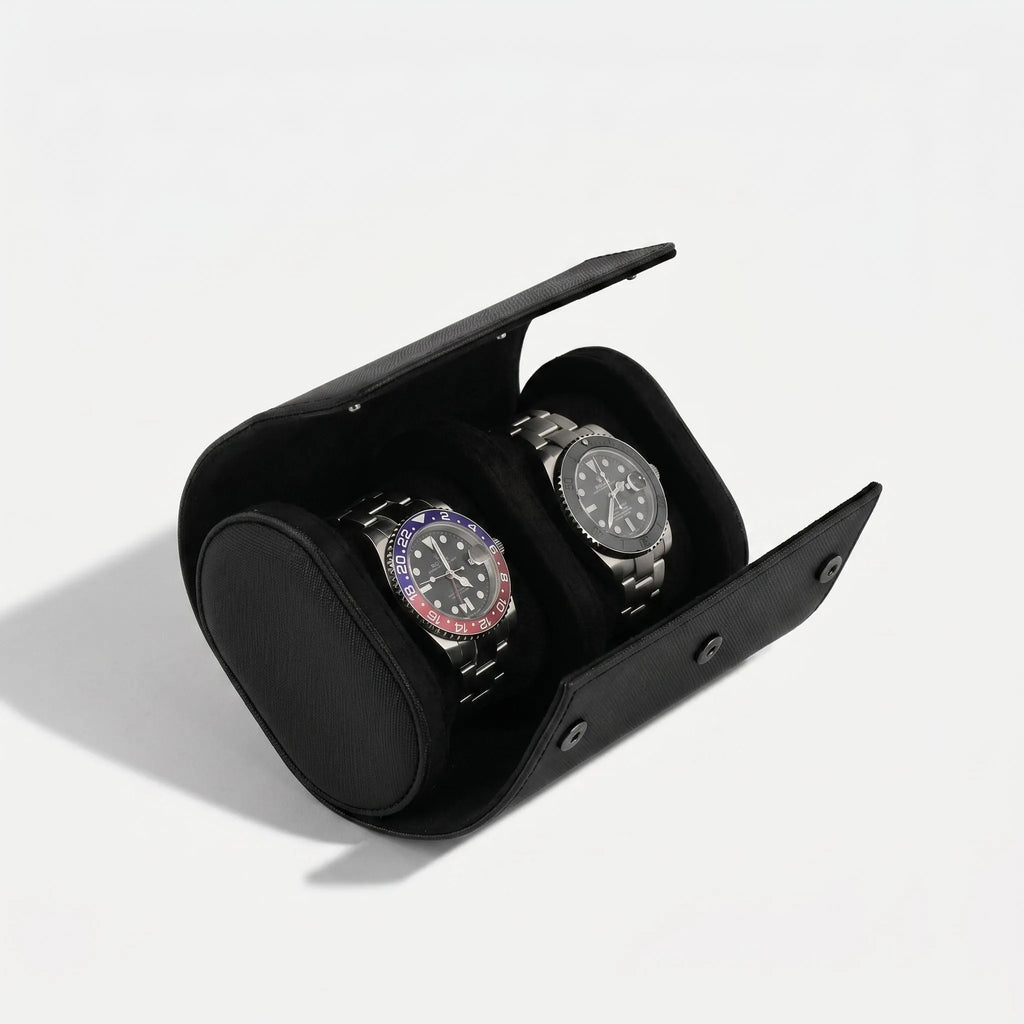 Close-up of premium double watch roll in black saffiano vegan leather with soft black lining, detailed texture and gentle side shadow, emphasizing luxury.