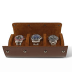 Elegant triple watch roll in brown vegan leather with soft tan suede lining, showcased with natural right-side light and gentle shadow for detail.