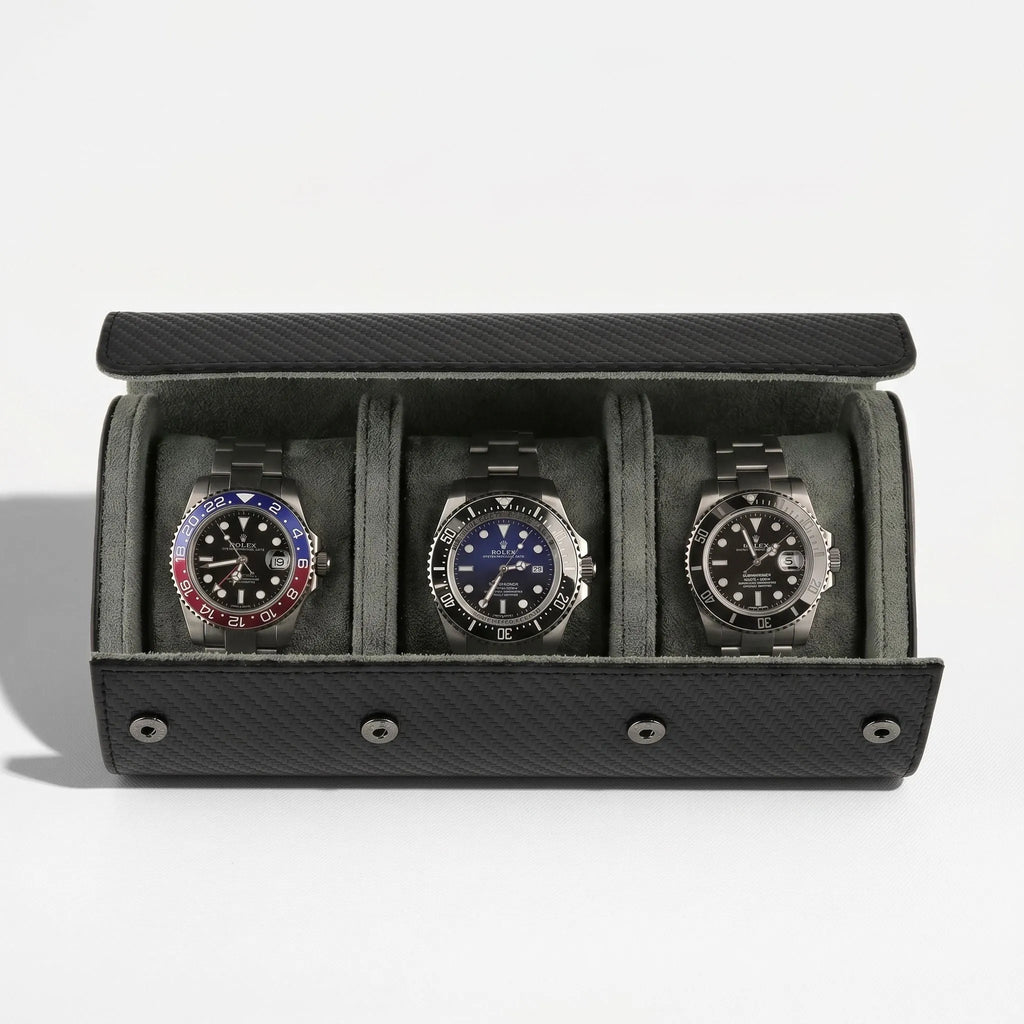 Luxurious triple watch roll in carbon fibre vegan leather with green lining and metal closures, displayed without background with gentle shadow.