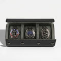 Luxurious triple watch roll in carbon fibre vegan leather with green lining and metal closures, displayed without background with gentle shadow.