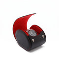 Compact single watch roll case crafted from premium black Nappa leather with red Alcantara lining, designed for luxurious watch travel storage.
