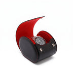 Compact single watch roll case crafted from premium black Nappa leather with red Alcantara lining, designed for luxurious watch travel storage.