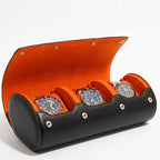 Enhanced image of the luxury triple watch roll case in black Nappa leather with orange Alcantara lining, featuring a soft right-side shadow and clear details.