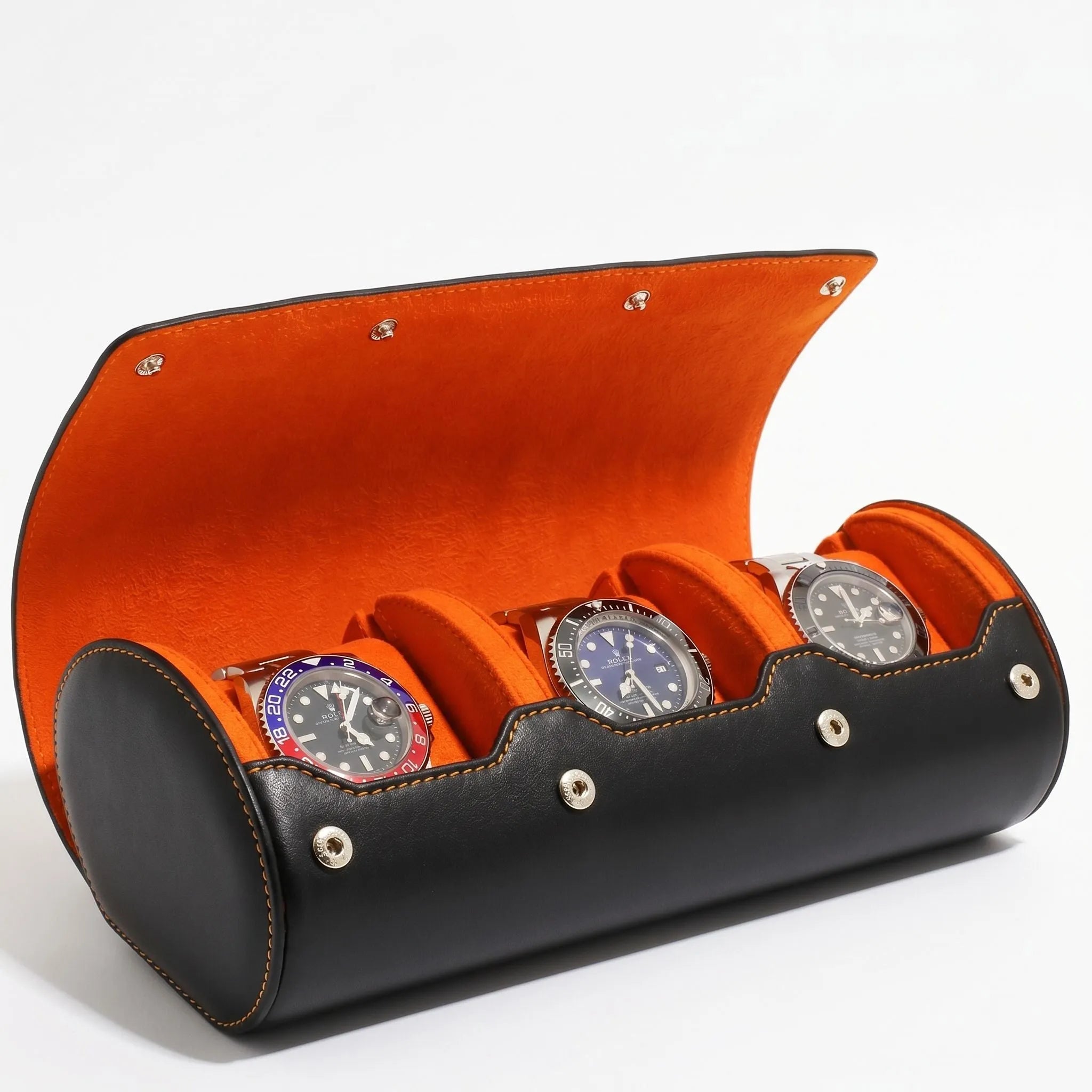 Enhanced image of the luxury triple watch roll case in black Nappa leather with orange Alcantara lining, featuring a soft right-side shadow and clear details.