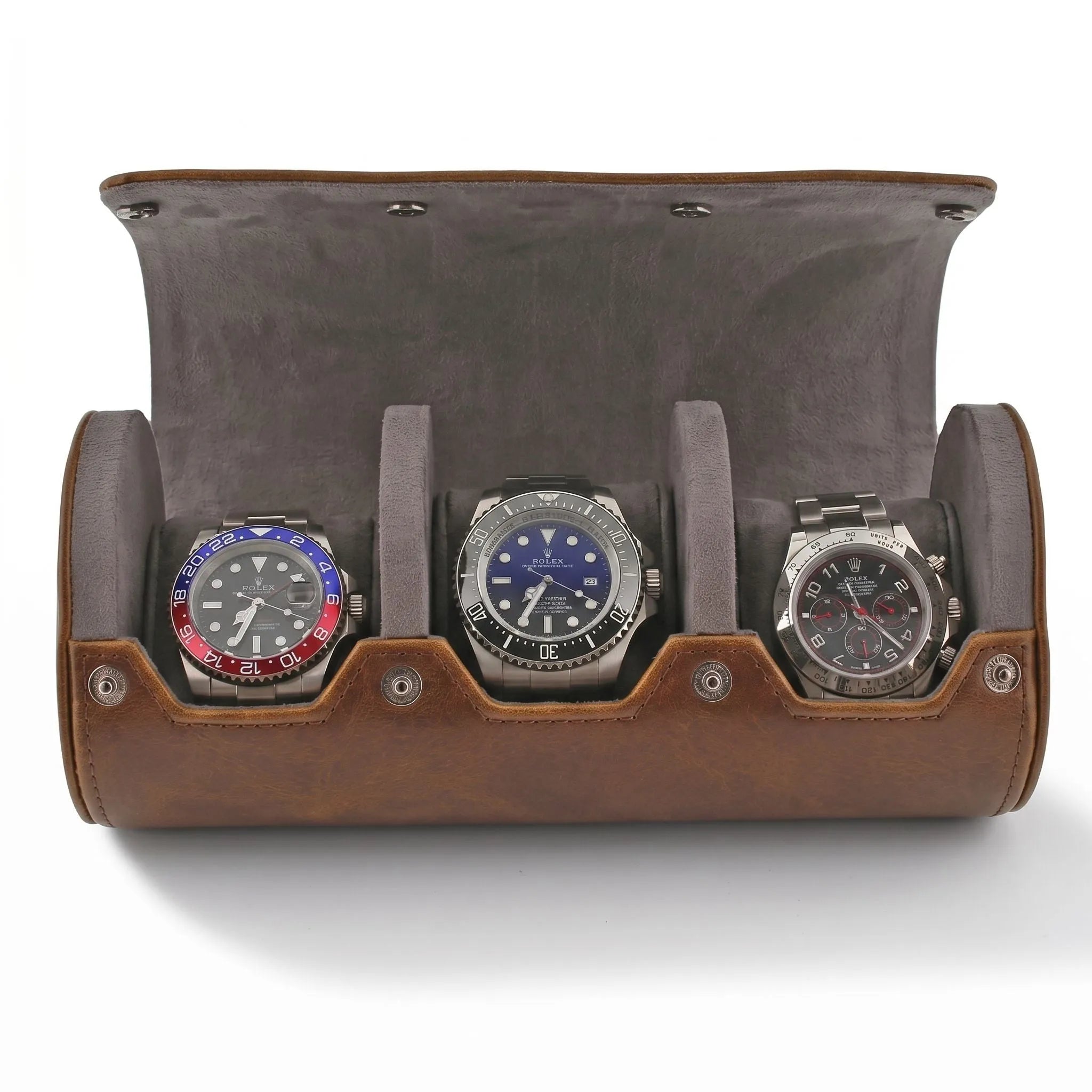 Close-up of vintage brown leather watch roll with grey suede lining, highlighting smooth texture and fine stitching, with gentle side lighting.
